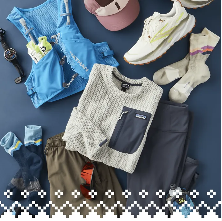 Assorted running gear and apparel laid out on the ground