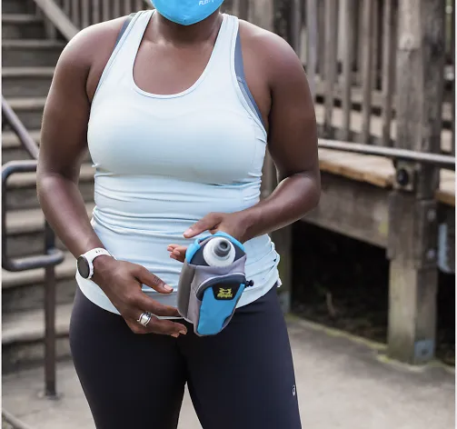 Woman using running water bottle 