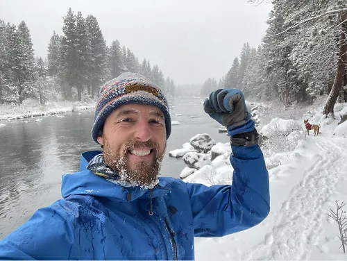 Nate smiles during a snowy run.