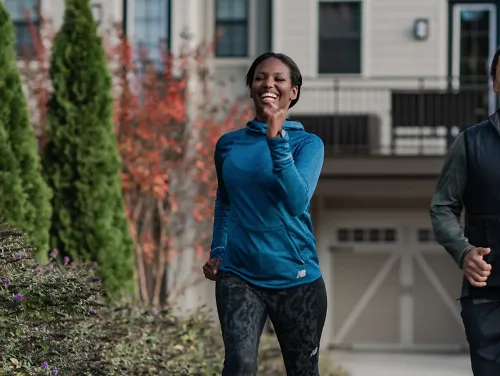 Runners wearing New Balance Heat Grid Apparel