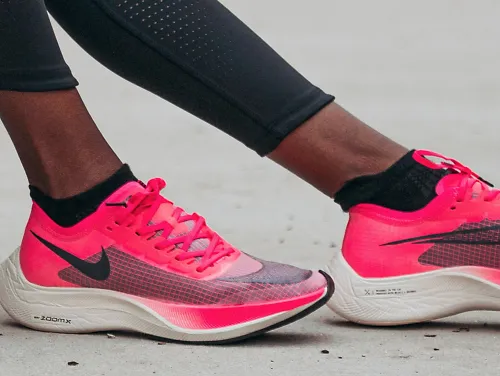 A runner models the pink Nike Vaporfly NEXT%