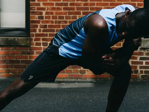 A man wearing the On Hybrid Shorts