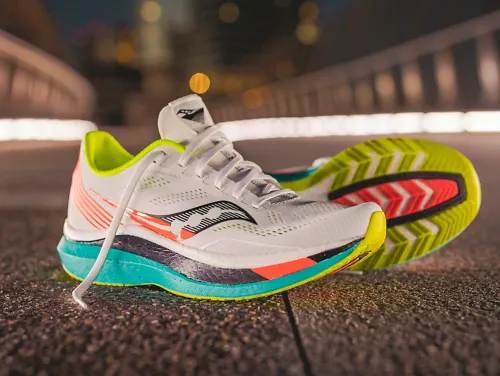 A pair of the Saucony Endorphin Pro running shoes on a bridge