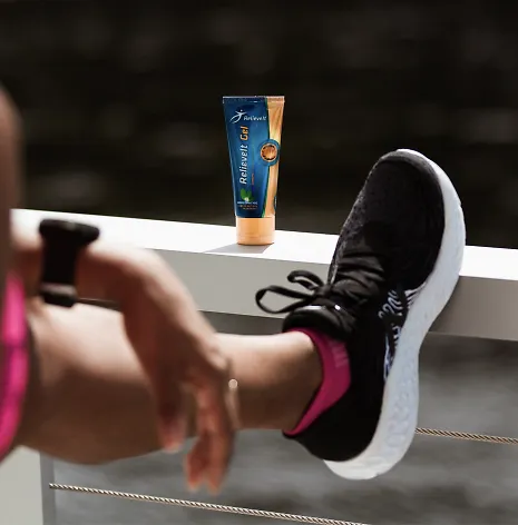 Woman stretching before applying RelieveIt cream
