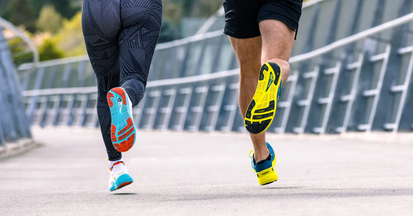 A shot of two runners in Topo shoes from behind