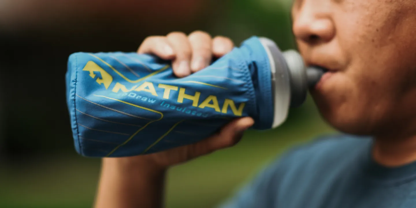 A man drinking out of water bottle